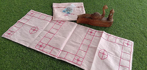 Dadu game spread embroidered on silk